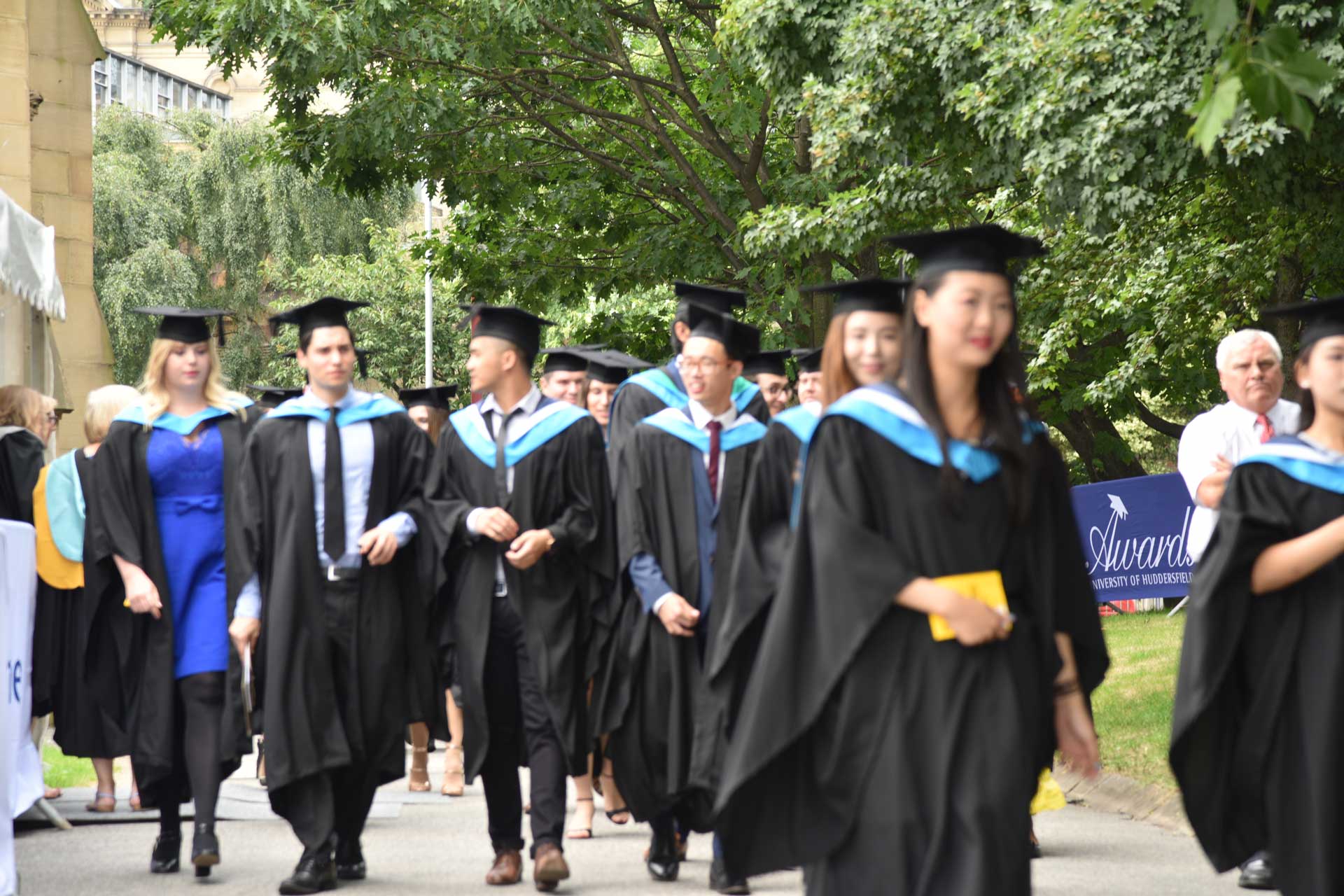 Graduates coming our of St. Pauls on their graduation day
